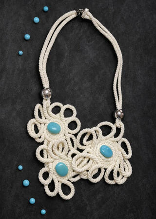 No. 6: Braided chain necklace with turquoise cabochons. The braided design combines with vibrant pops of color to make this necklace a real eye-catcher.
