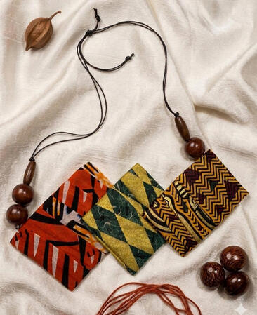 No. 7: Afro-Cuban Ankara rectangular pendant necklace with wooden beads. Various patterns and colors come together to create a vibrant and expressive design.